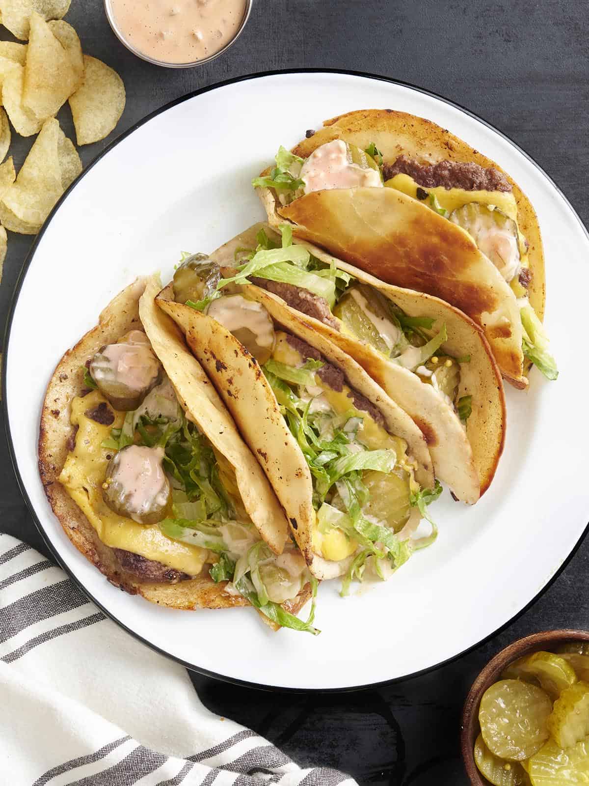 Overhead view of a plate of homemade smash burger tacos.