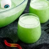 Side view of two glasses of witches brew halloween punch.