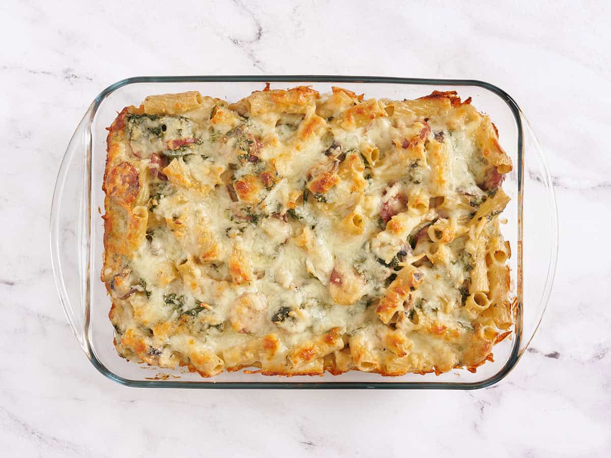 Baked Turkey sausage and kale casserole in a baking dish.