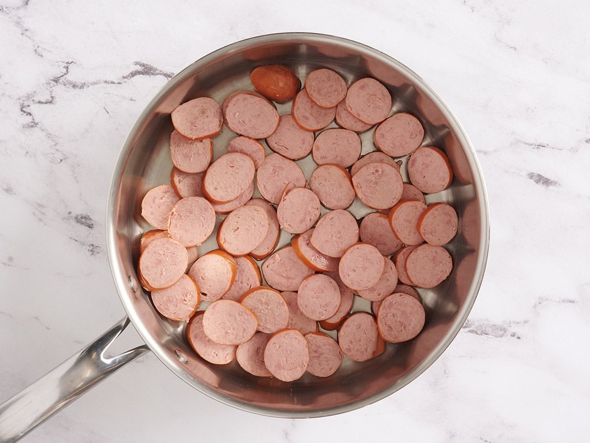 Sliced turkey sausage in a skillet.