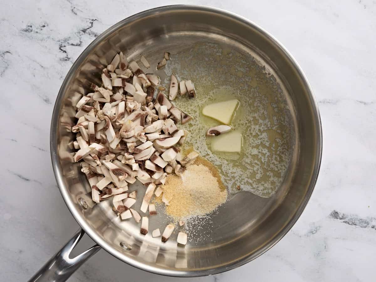 Mushrooms, butter, and seasonings in a skillet.