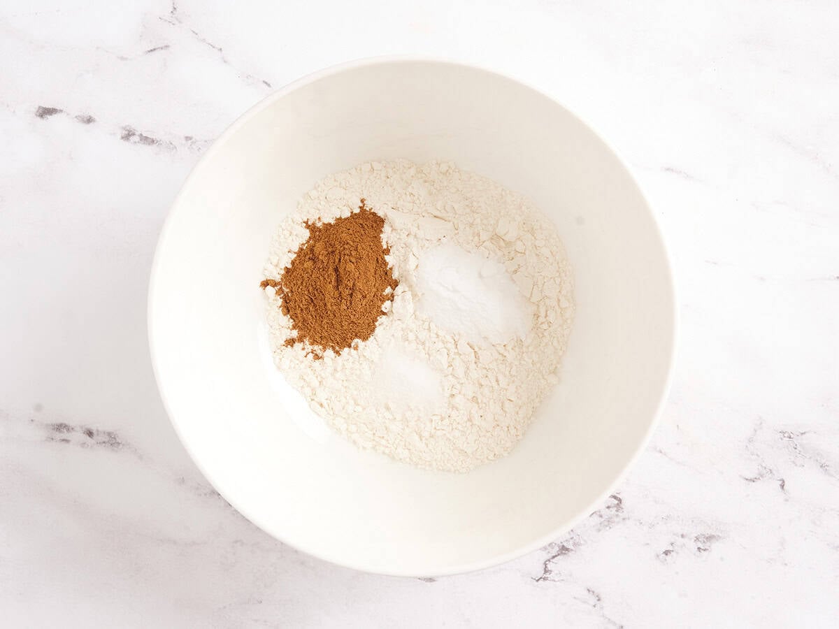 pumpkin roll cake batter ingredients in a bowl