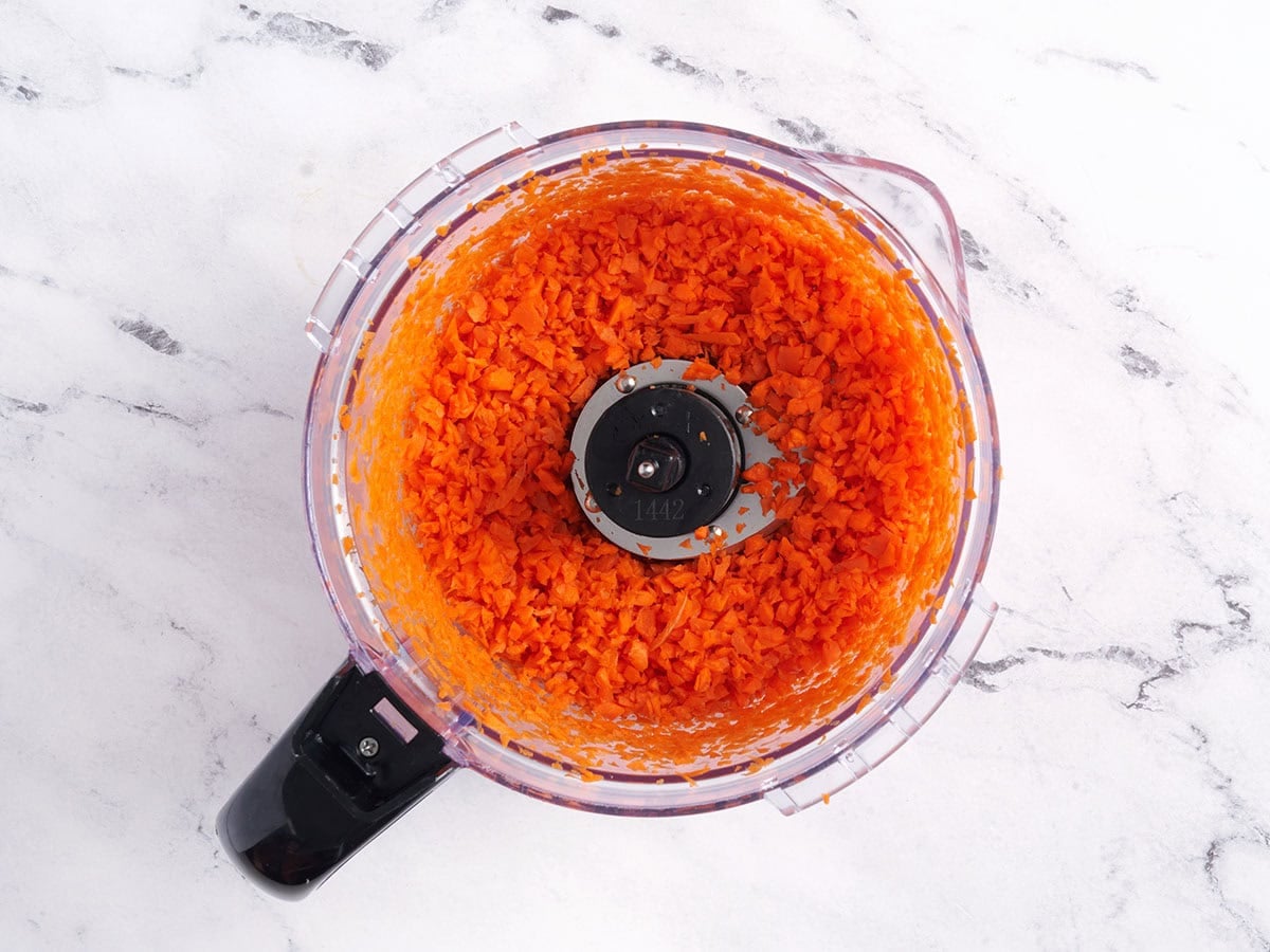 Carrots in a food processor.