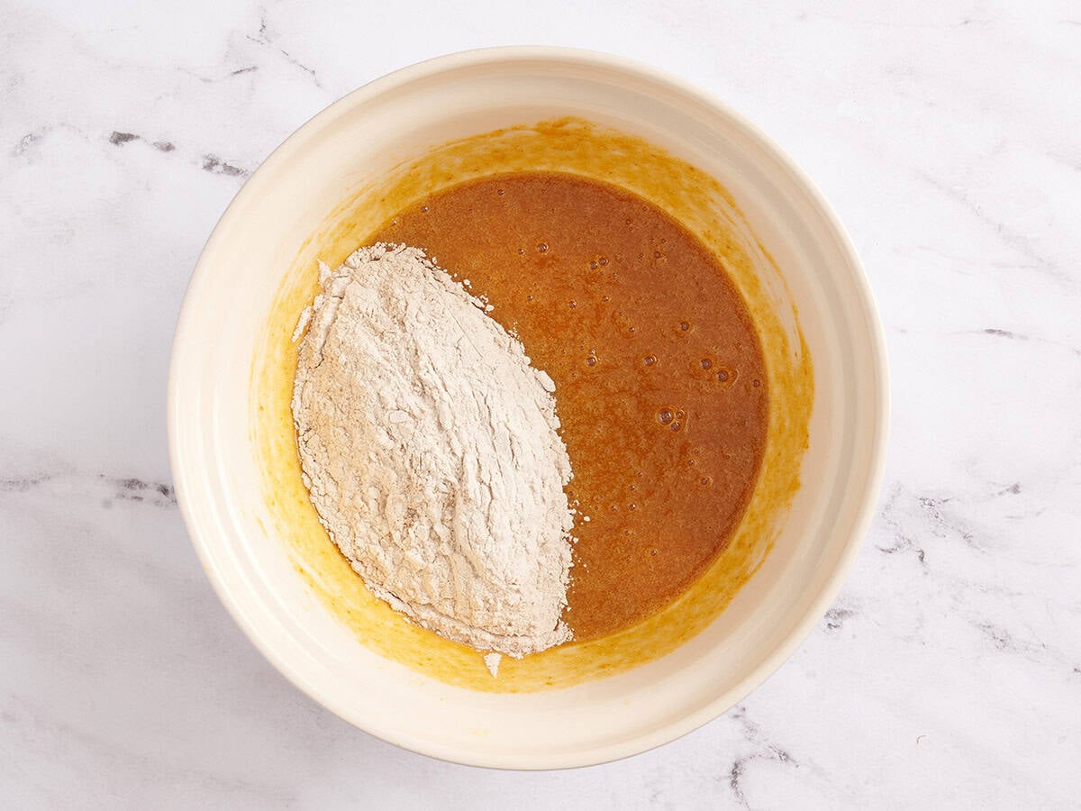 pumpkin roll cake batter ingredients in a bowl