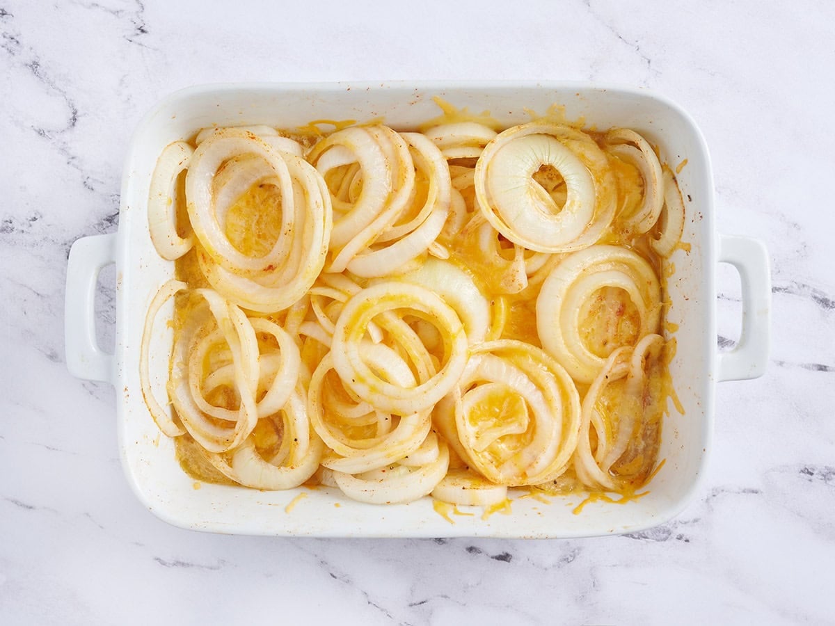 Tennesse onions in a baking dish midway through cooking.