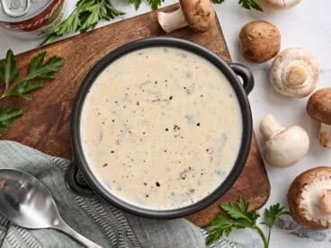 Overhead view of a bowl of cream of mushroom soup.