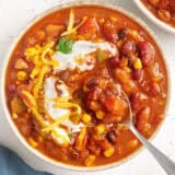 overhead view of vegetarian chili topped with all the fixings