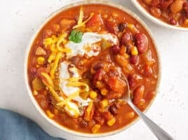 overhead view of vegetarian chili topped with all the fixings