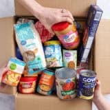 box of pantry items being donated to food bank