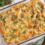Overhead view of a turkey sausage and kale casserole in a baking dish.