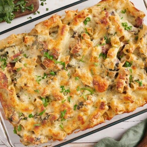Overhead view of a turkey sausage and kale casserole in a baking dish.
