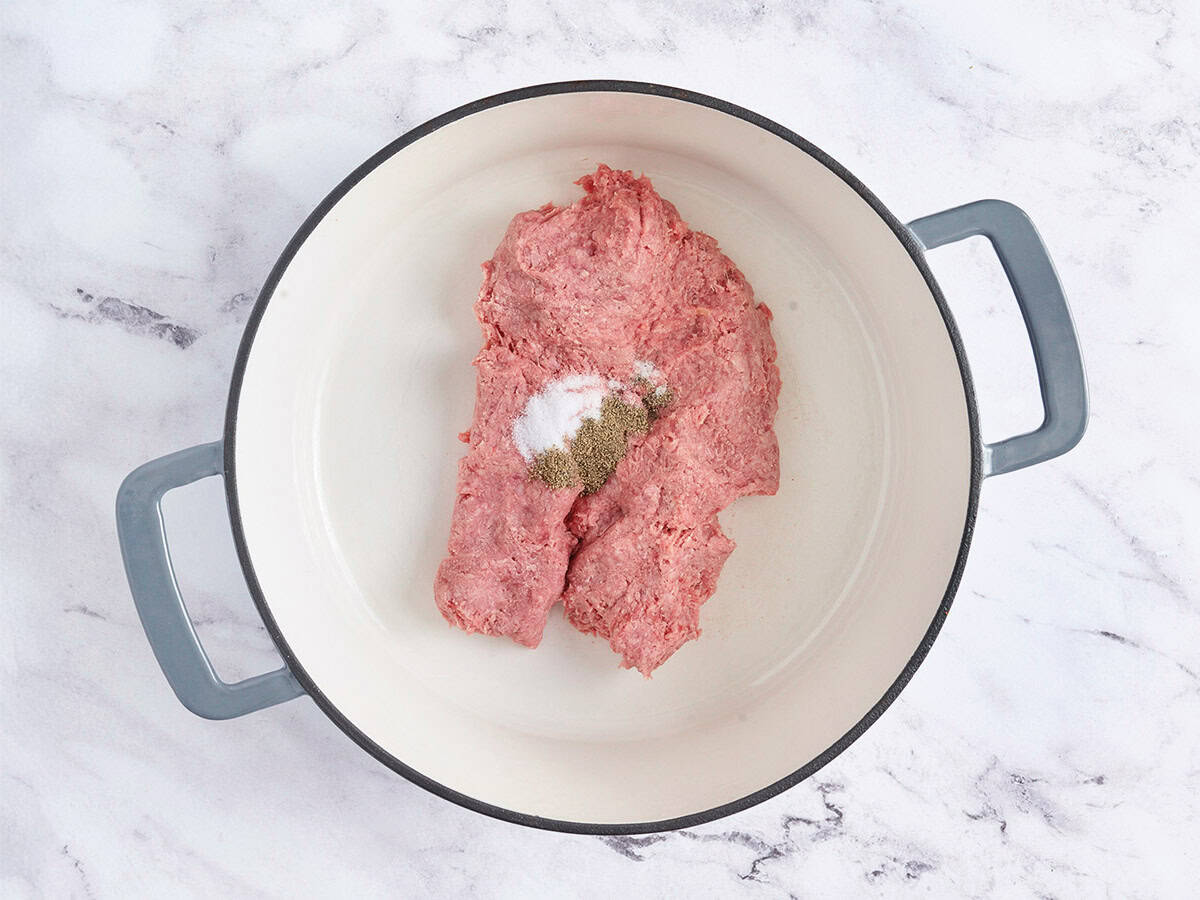 Ground beef and seasonings in a pot.