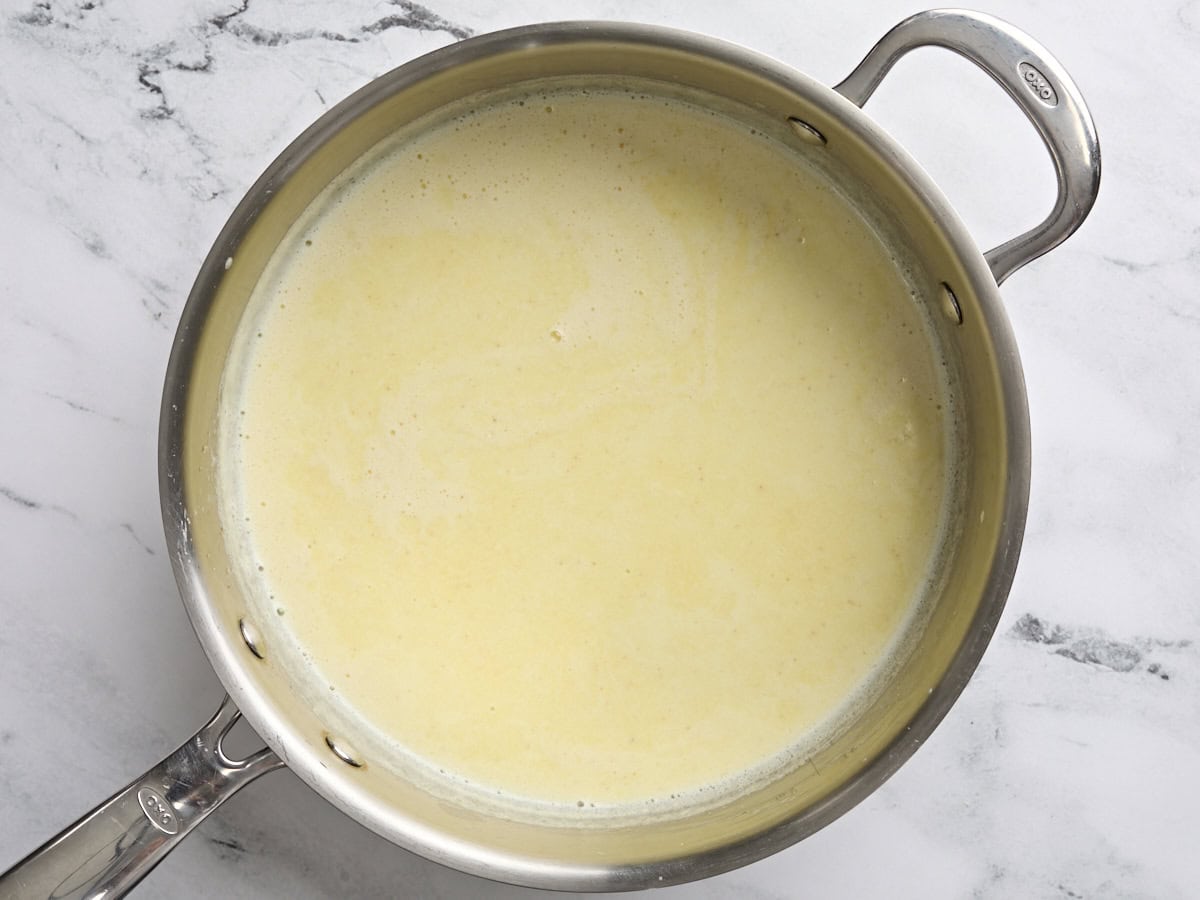 A saucepan of homemade cream of chicken soup.