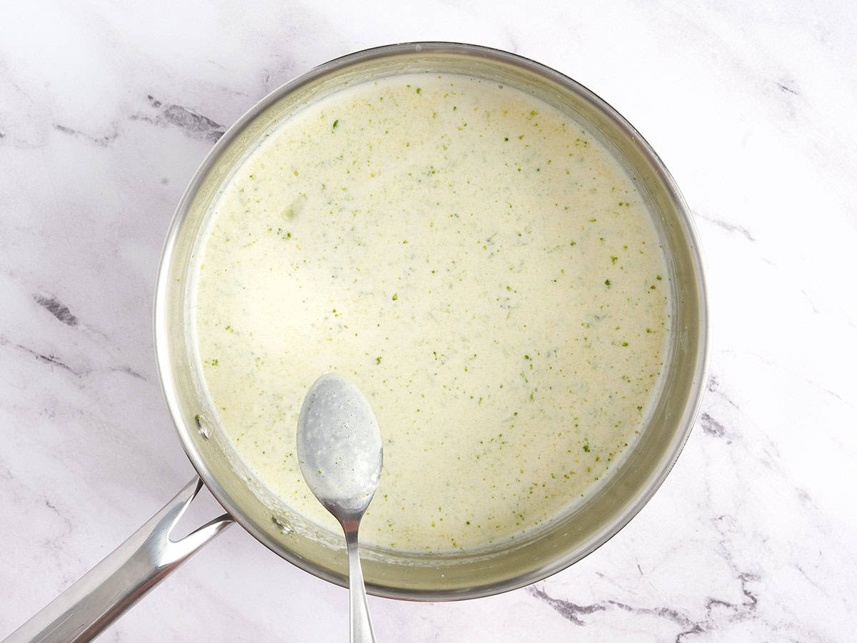 Homemade cream of broccoli soup in a saucepan.