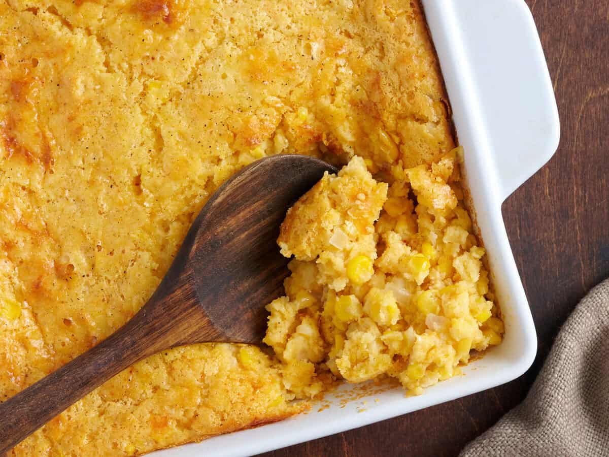 Wooden spoon in the cornbread casserole.