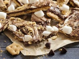 S'mores bark on a piece of parchment paper.