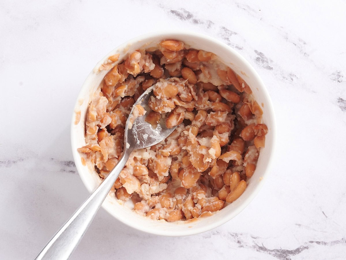 Mashed beans in a bowl.