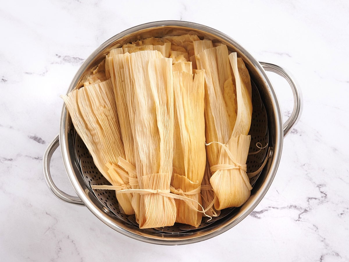 Finished tamales in a saucepan.