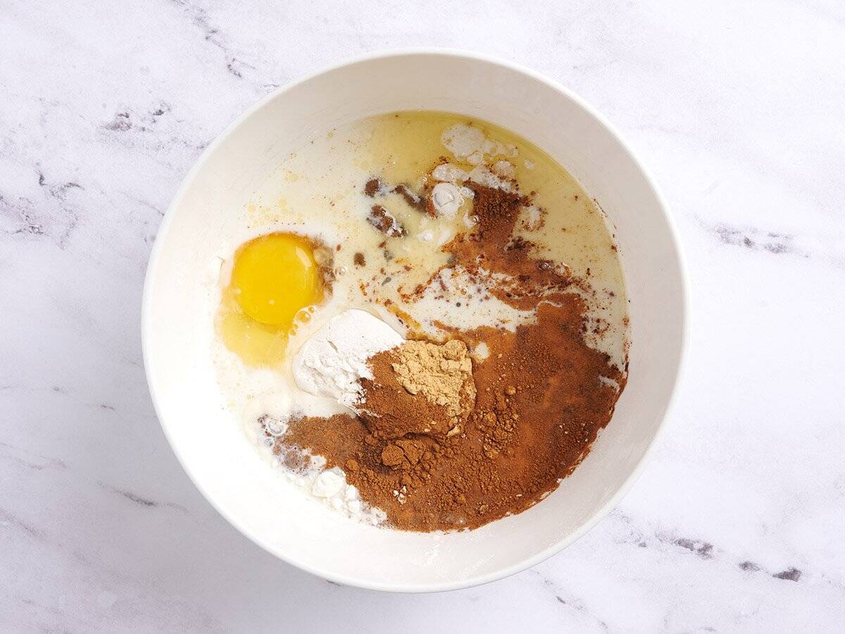 All the ingredients to make homemade gingerbread pancakes in a bowl.