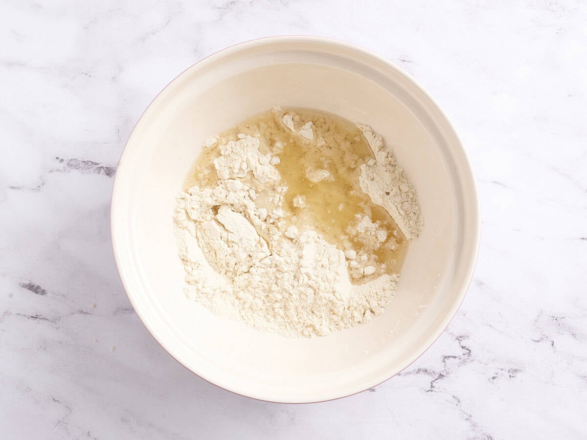 Oil added to dry ingredients to make tamale dough.