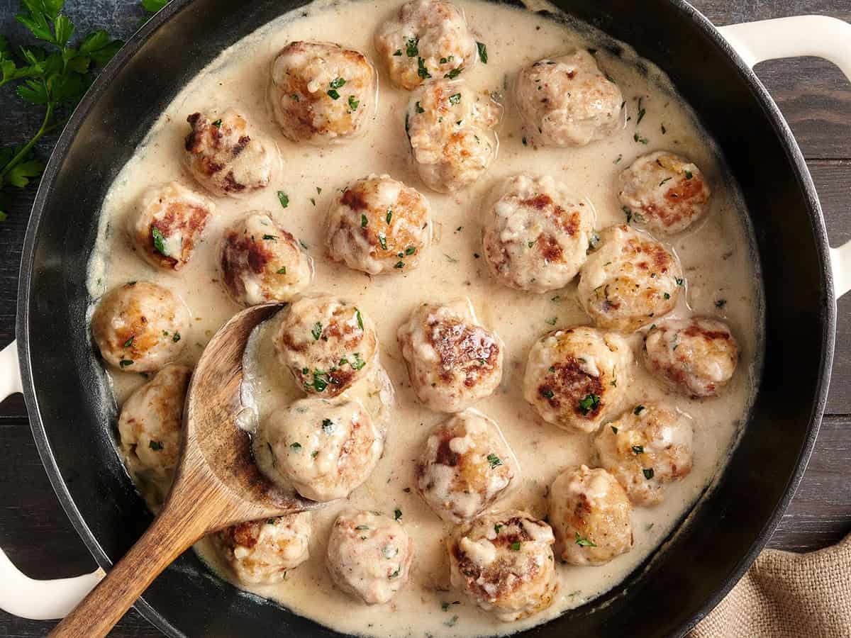 chicken meatballs in cream sauce in skillet