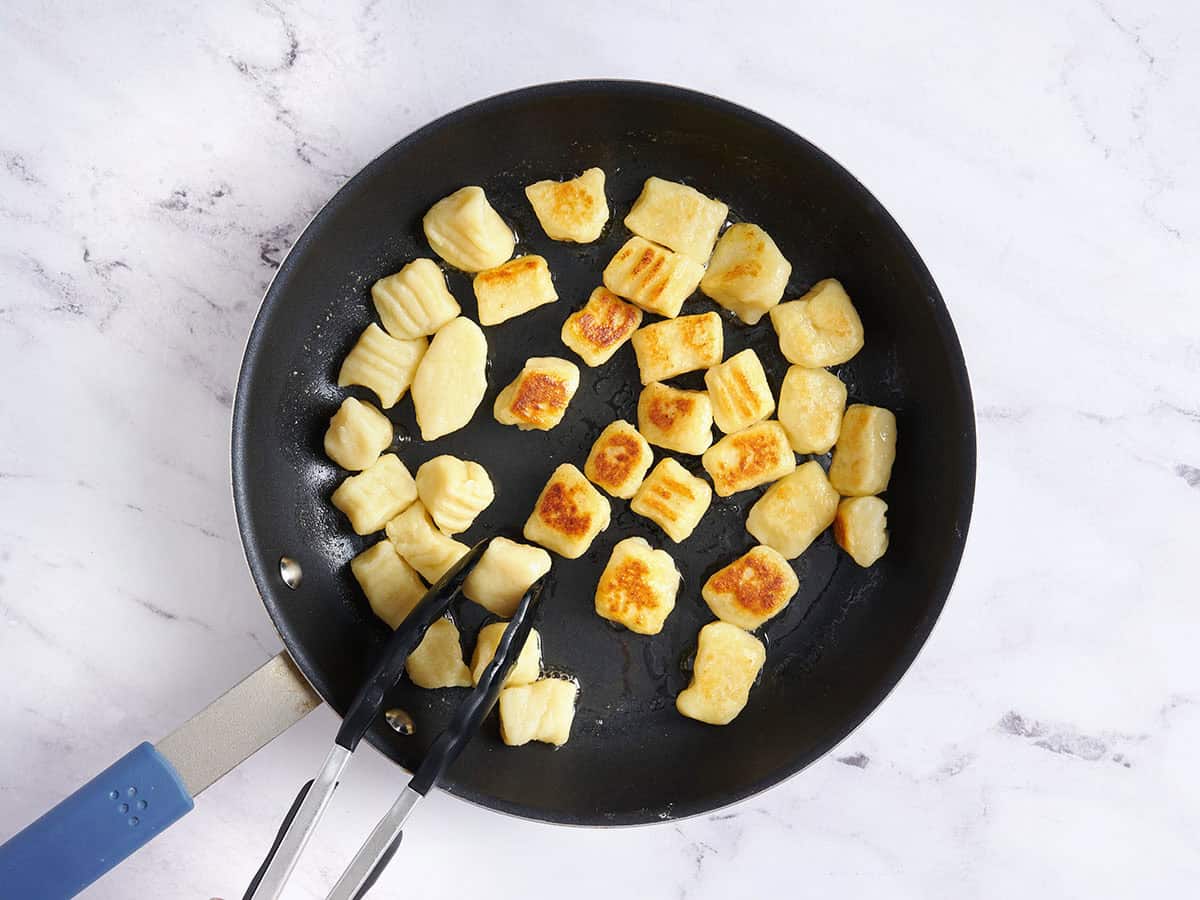 Pan frying the gnocchi.