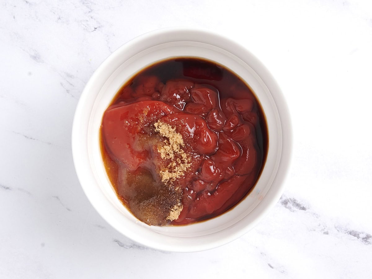 Ingredients for the sauce in a white bowl.