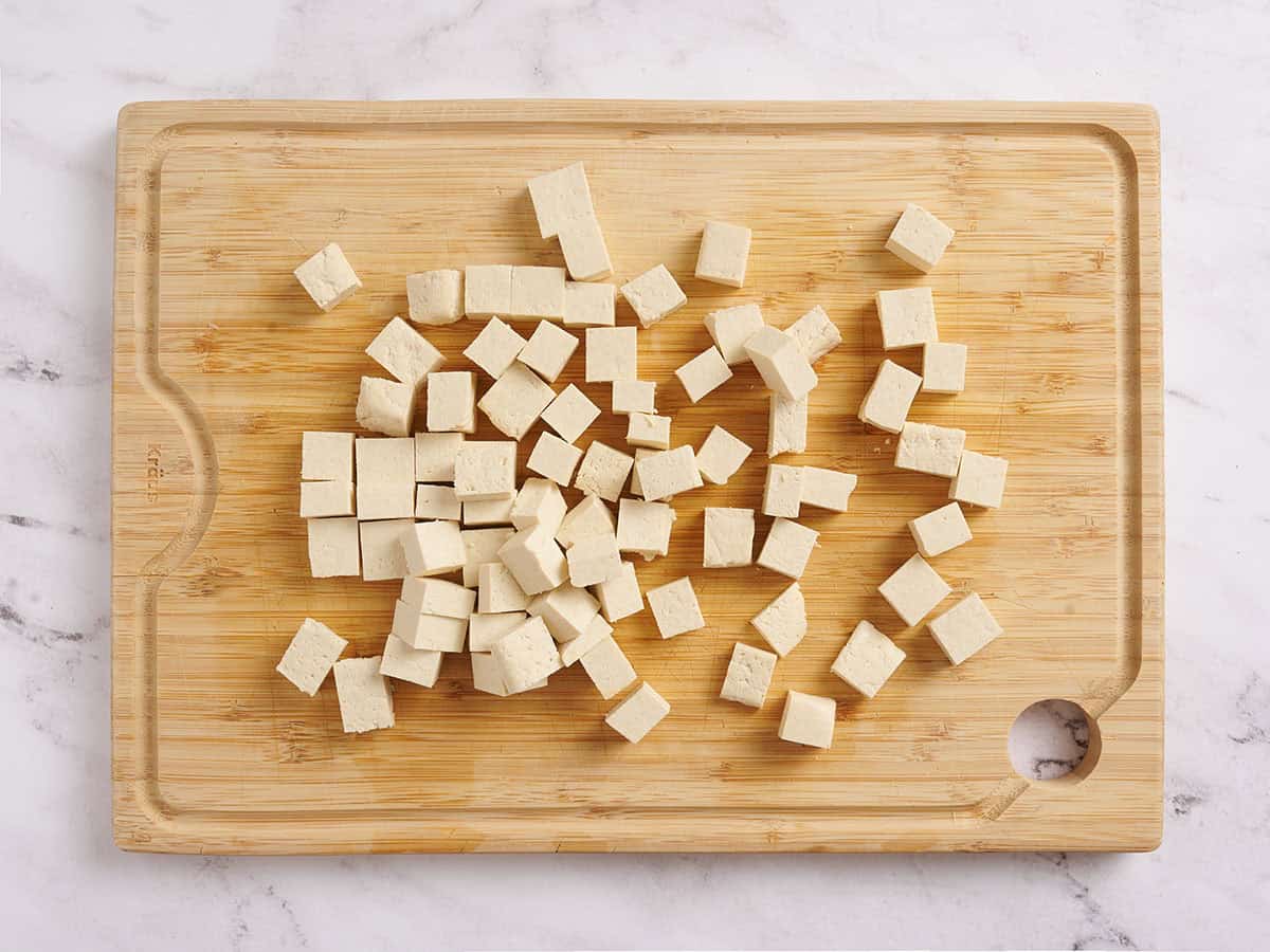 Pressed tofu cut into squares.