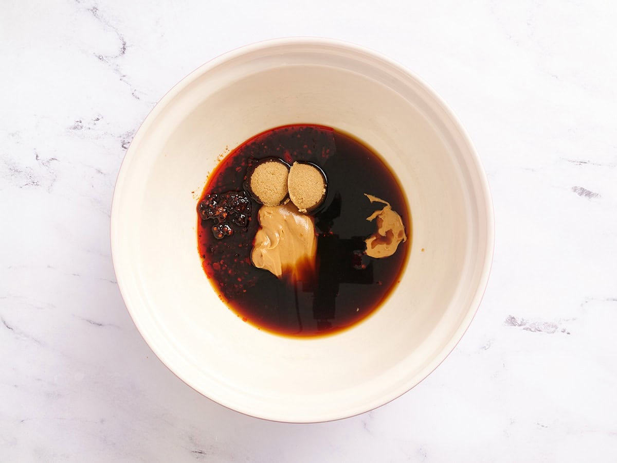The ingredients to make dan dan noodle sauce in a bowl.
