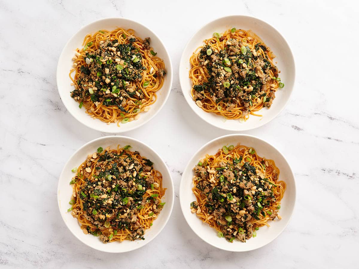 Four bowls of homemade Dan dan noodles.
