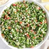 Overhead view of a bowl of fresh cauliflower tabbouleh.