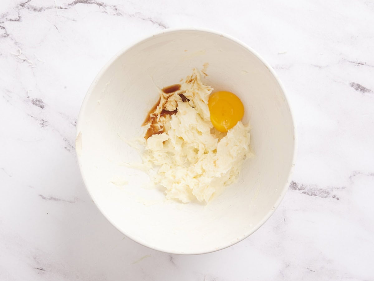 An egg yolk added to the cheesecake mixture for carrot cake bars.