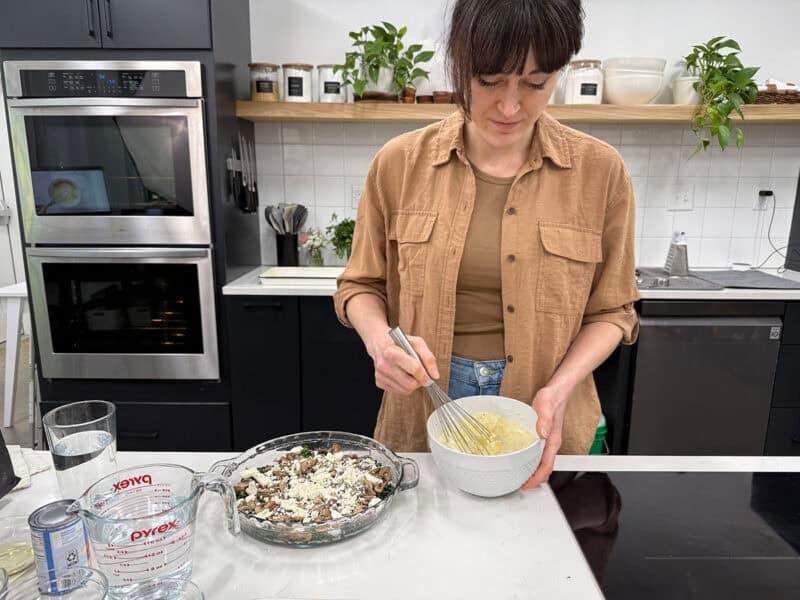 woman making crustless quiche