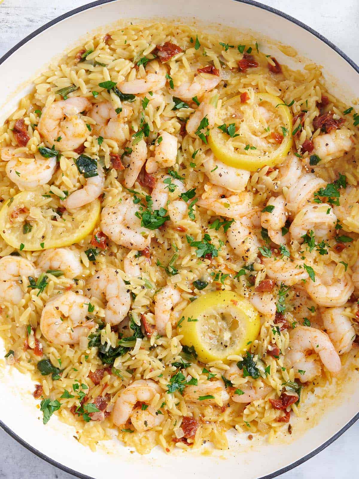 Overhead view of a garlic shrimp and orzo skillet.