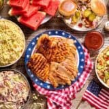 Overhead view of a 4th of July cookout table spread.