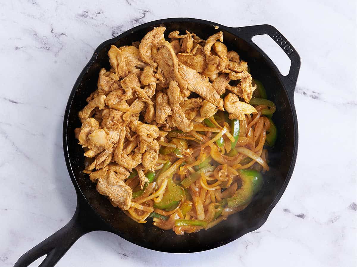 Stovetop chicken fajita filling in a skillet.