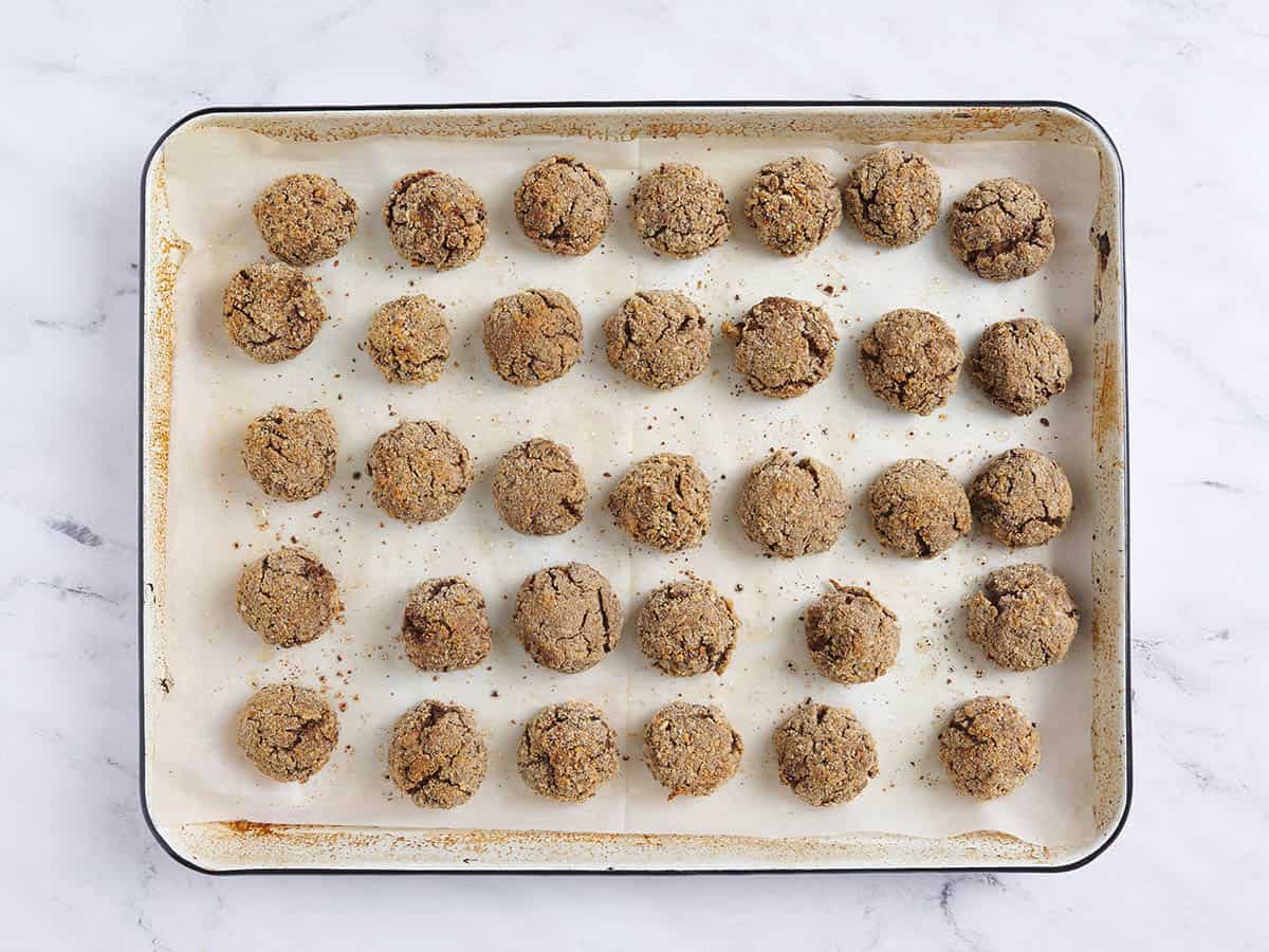 Vegan meatballs on a baking sheet.