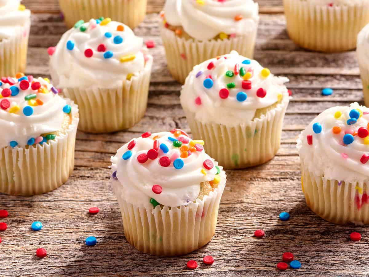 Side view of cupcakes with sprinkles.