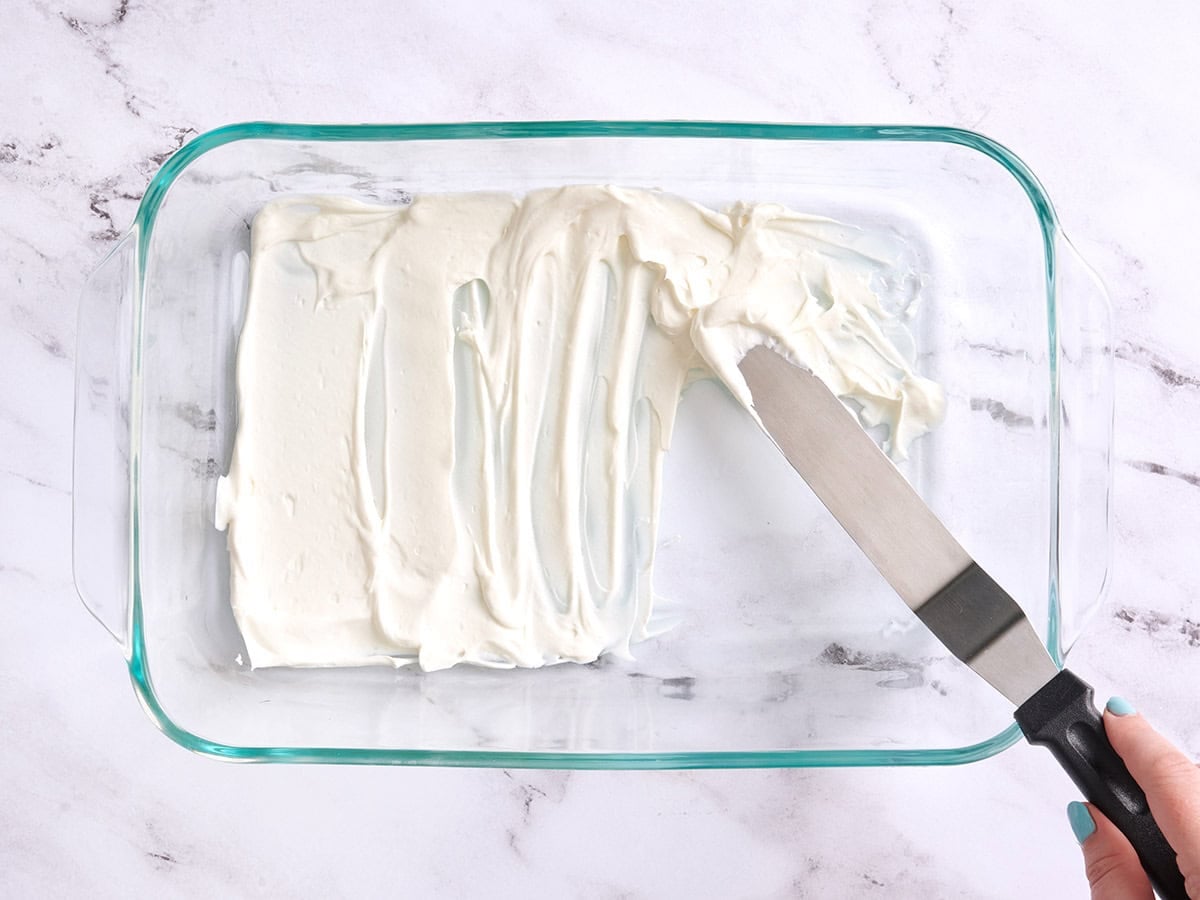 Whipped cream layered into a baking dish.
