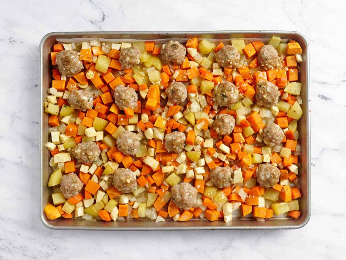 Dijon maple sauce added to sheet pan meatballs with root vegetables
