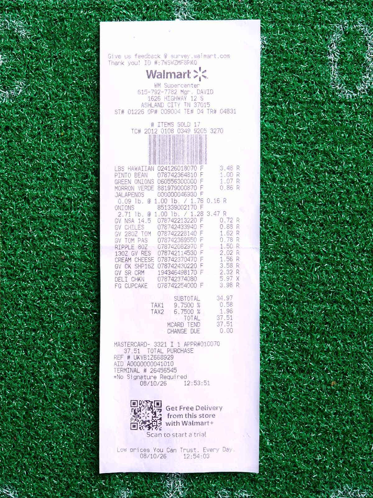 Overhead view of a Walmart receipt for a game day spread.
